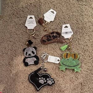 Set a four puffy keychains with rhinestones very cute brand new